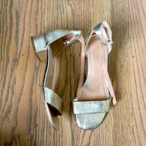 Metallic gold sandals with small heel